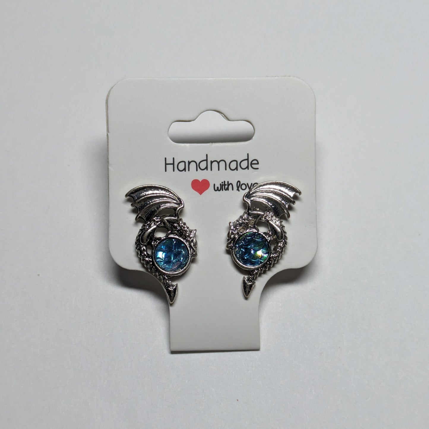 Dragon Baby Blue Gem Stud Earrings š